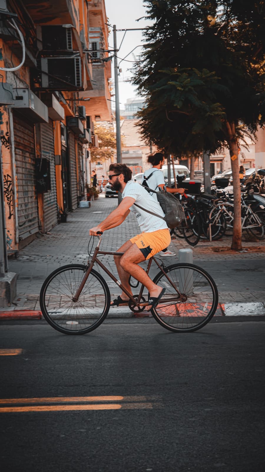 Commuter riding a gear cycle through the city