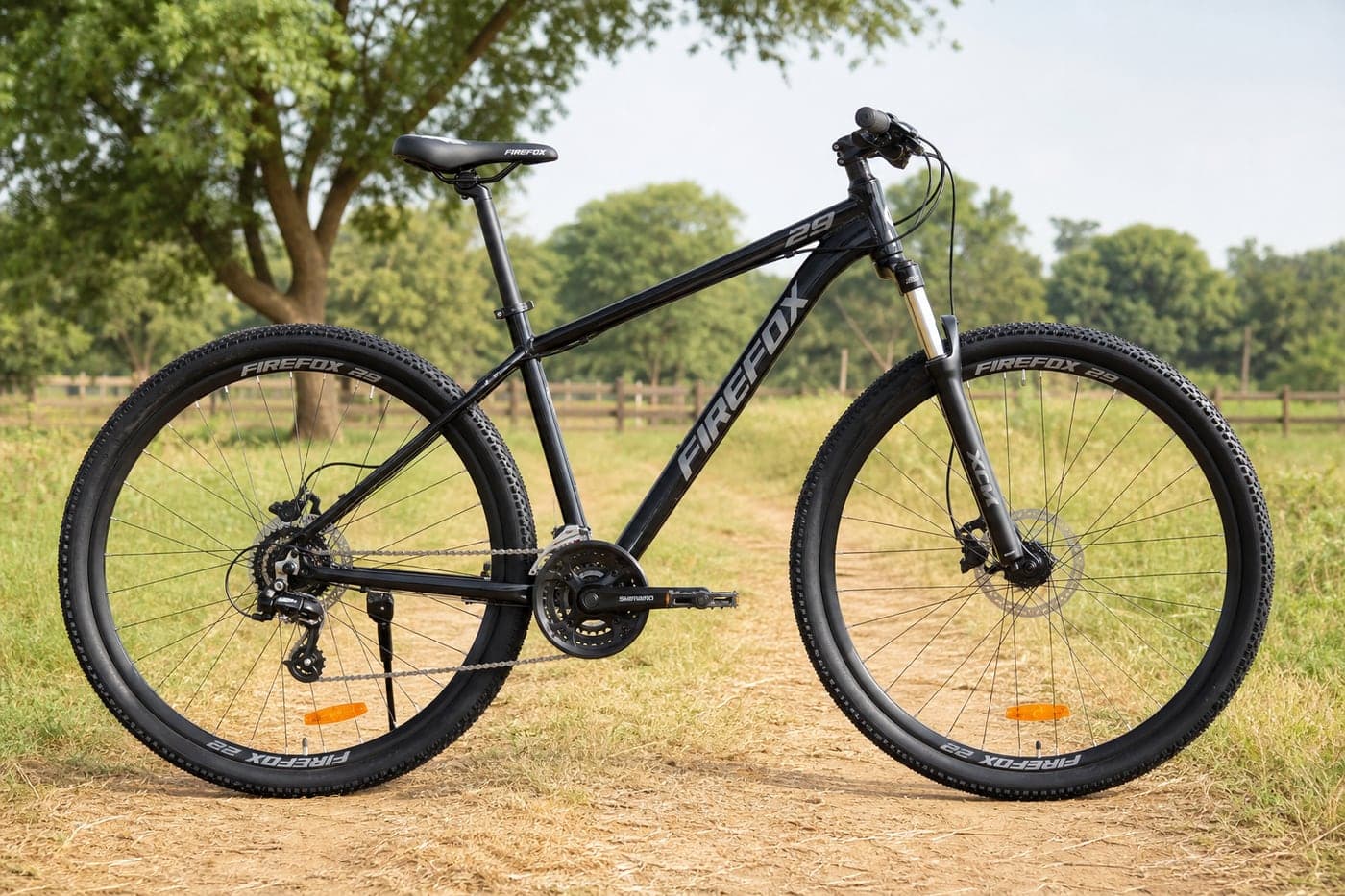 29 inch 21-speed gear cycle standing on a rural farm trail outdoors