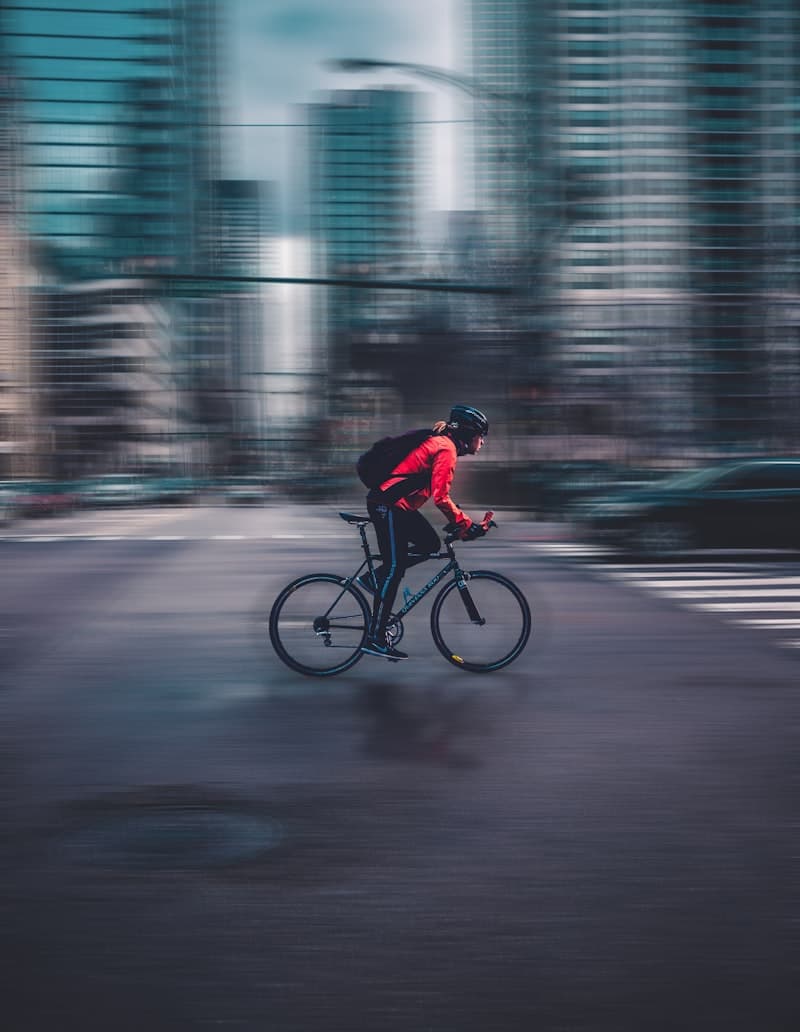 Cyclist speeding through the city in motion blur