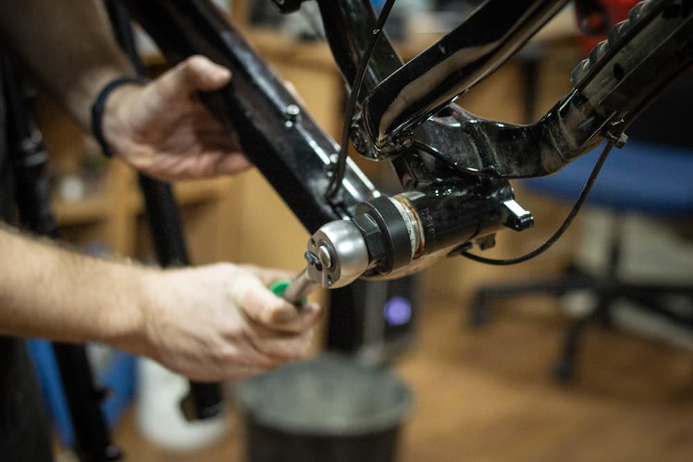 Mechanic servicing a bicycle in the workshop
